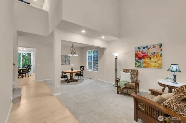 Open kitchen with dining space and desk.