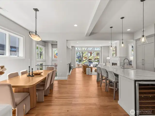 A light-filled, separate dining area offers an elegant space for intimate dinners and gatherings, bathed in natural sunlight.