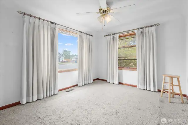 Living room with hardwood floors under carpet