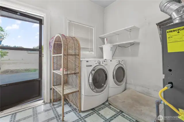 Laundry room washer and dryer included newer gas furnace.