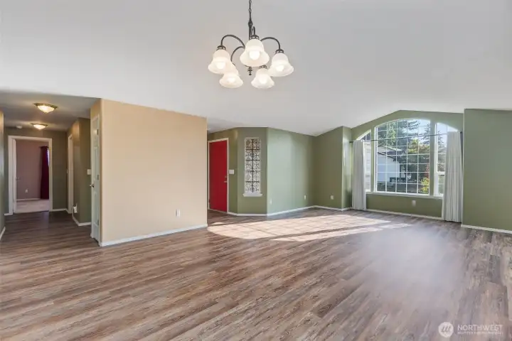The front room looking toward the front of the home. The bedrooms are down the hall on the left.