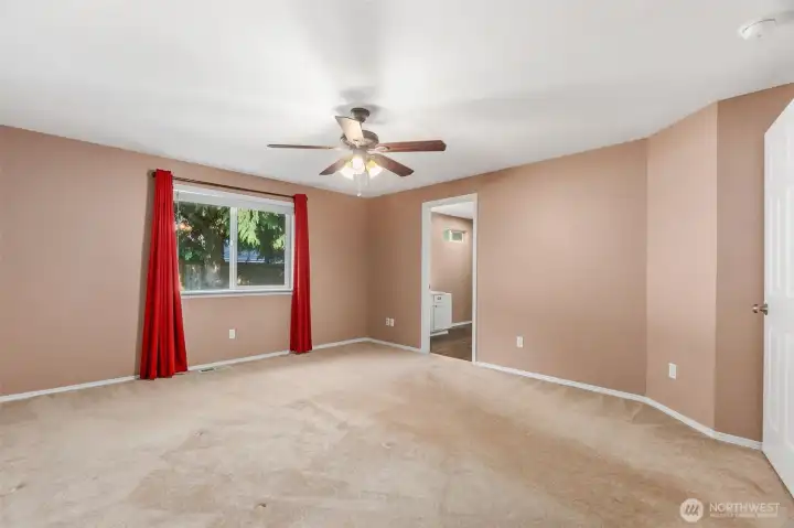 Large window in the primary bedroom for natural light.