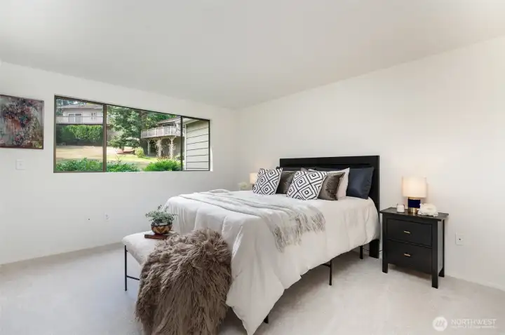 Large primary suite can accommodate a king size bed