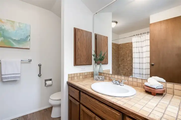 En-suite full bath in the Primary with newer flooring.