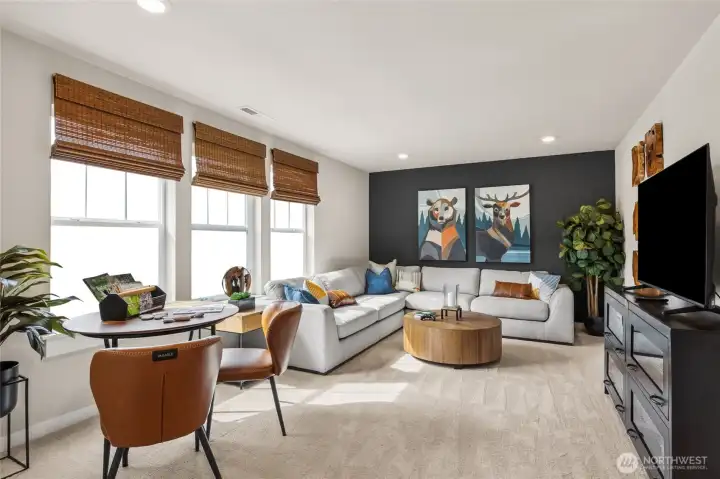 Bonus room perfect for media or gameroom or playroom. Photo is representational. Actual home is under construction and finishes and paint colors may vary. See site agent for details.