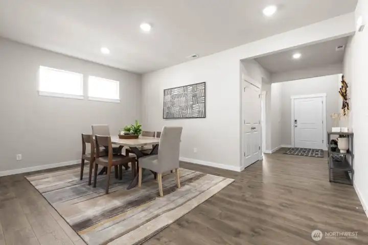 Formal dining room perfect for hosting. Photo is representational. Actual home is under construction and finishes and paint colors may vary. See site agent for details.