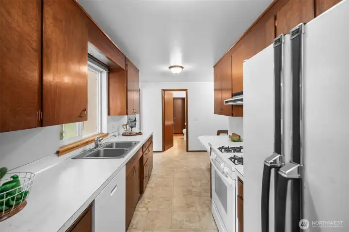 Gas cooking and a window out to the backyard! Both are a bonus!