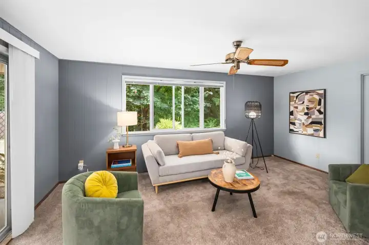 Multiple living spaces allow for double the activities! Notice the ceiling fan for a nice breeze.