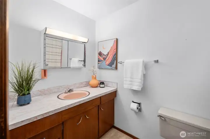A full size bath with tub and shower! Perfect for sharing.