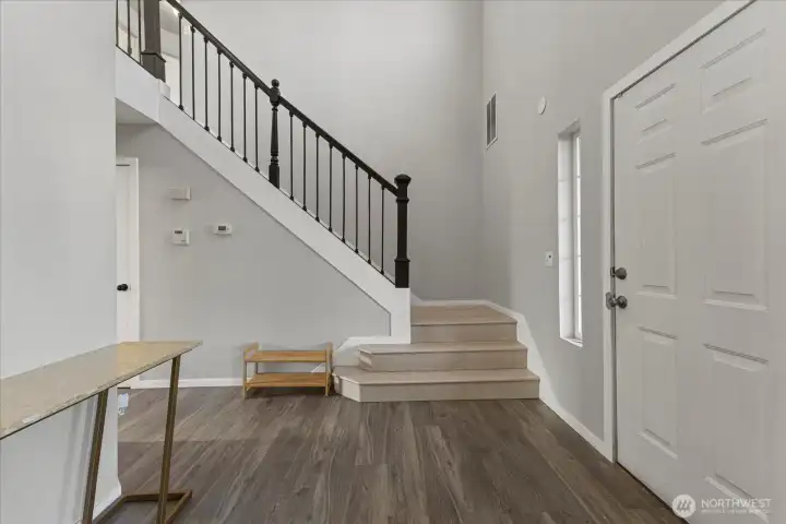Open entry that leads upstairs, to the kitchen, or to the Great Room!