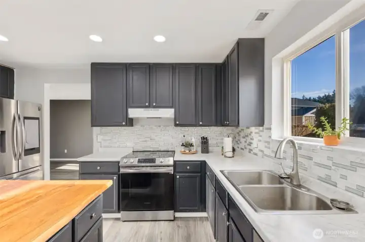Lots of cabinet space for storage and a window that offers natural light and a breath of fresh air!