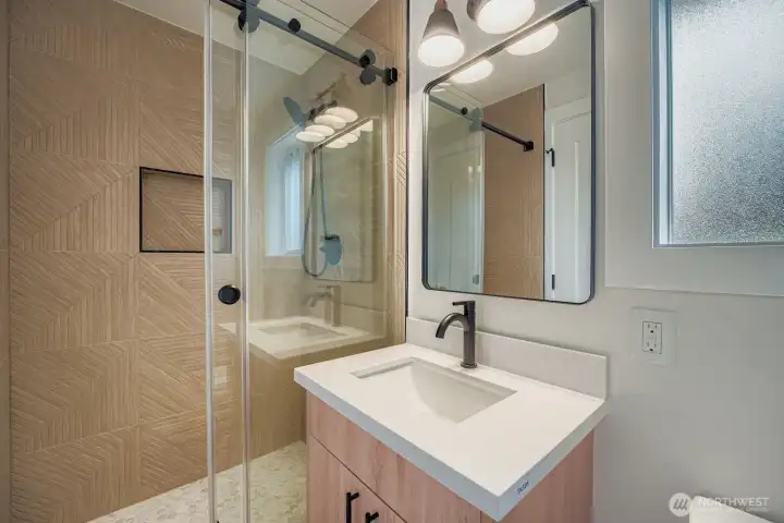 Oversized shower in hall bathroom.