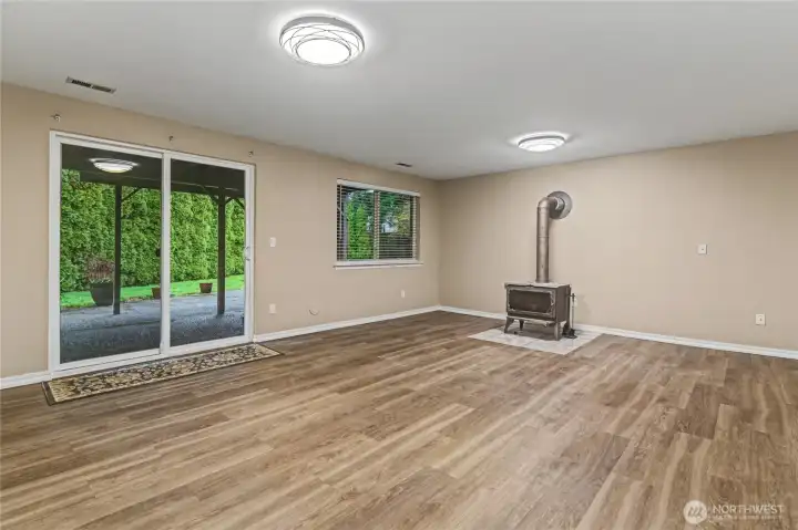 Huge downstairs living room with stand up wood stove.