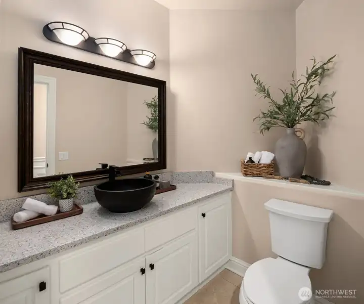 Main level 1/2 bath with plenty of storage