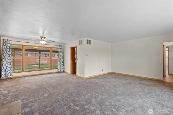 Living area plus dining room overlooking the back yard