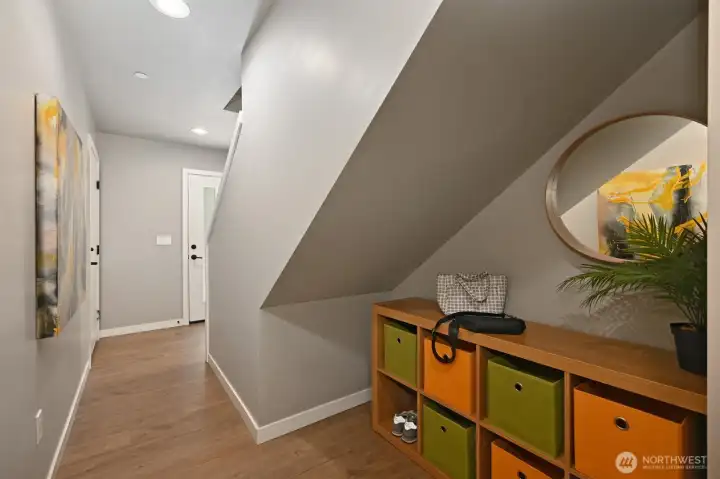 Nice cubby for shoes and gear under the stairs near the entry. Nice cubby for shoes and gear under the stairs near the entry.