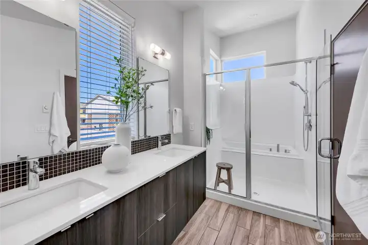 Well Appointed Primary Bath with Double Vanity, Water Closet, and Soaking Tub Well Appointed Primary Bath with Double Vanity, Water Closet, and Soaking Tub