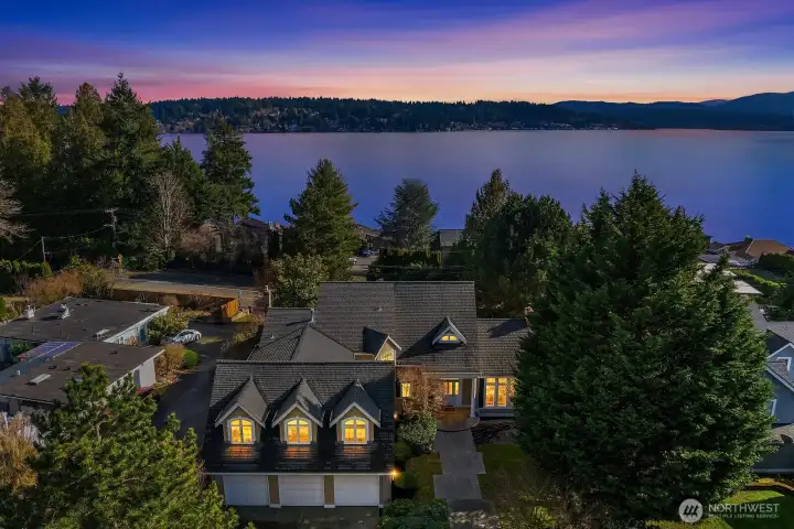 This stunning twilight aerial captures the magic of this rare custom residence set within a private 7-home enclave, showcasing sweeping views of Lake Sammamish, lush surroundings, and an unparalleled setting that truly must be seen to be believed. This stunning twilight aerial captures the magic of this rare custom residence set within a private 7-home enclave, showcasing sweeping views of Lake Sammamish, lush surroundings, and an unparalleled setting that truly must be seen to be believed.