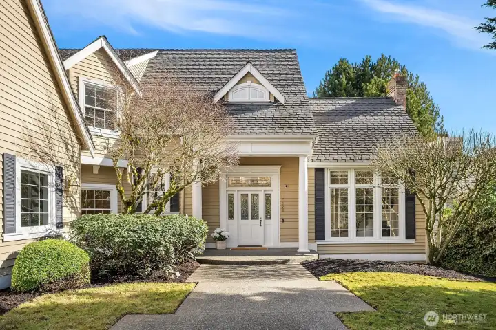 A beautifully detailed front entry with classic columns, elegant transom windows, and manicured landscaping sets the tone for the refined and thoughtfully designed interiors that await within this exceptional Lake Sammamish residence. A beautifully detailed front entry with classic columns, elegant transom windows, and manicured landscaping sets the tone for the refined and thoughtfully designed interiors that await within this exceptional Lake Sammamish residence.