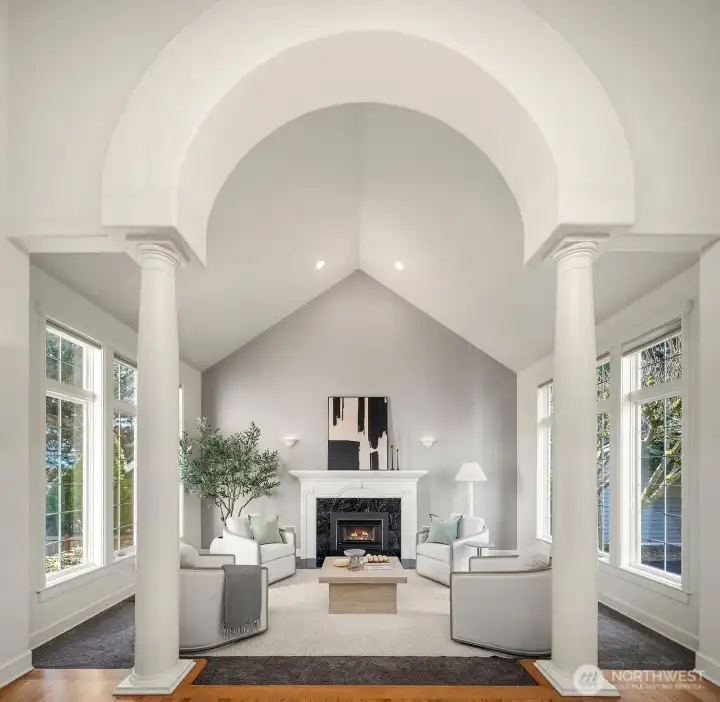 Dramatic arched ceilings, elegant columns, and a classic fireplace create a breathtaking formal living room that exudes timeless elegance, a truly grand space designed to impress and inspire from every angle. Dramatic arched ceilings, elegant columns, and a classic fireplace create a breathtaking formal living room that exudes timeless elegance, a truly grand space designed to impress and inspire from every angle.