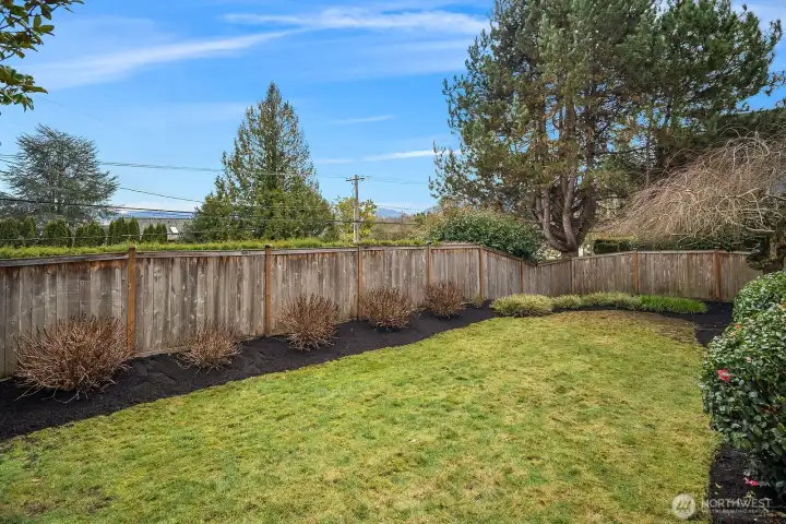 The fully fenced backyard provides a secluded and private retreat, featuring a generous, level lawn framed by mature trees and lush landscaping. This serene outdoor space offers plenty of room for play, gardening, or simply enjoying the tranquility of this private enclave setting. The fully fenced backyard provides a secluded and private retreat, featuring a generous, level lawn framed by mature trees and lush landscaping. This serene outdoor space offers plenty of room for play, gardening, or simply enjoying the tranquility of this private enclave setting.