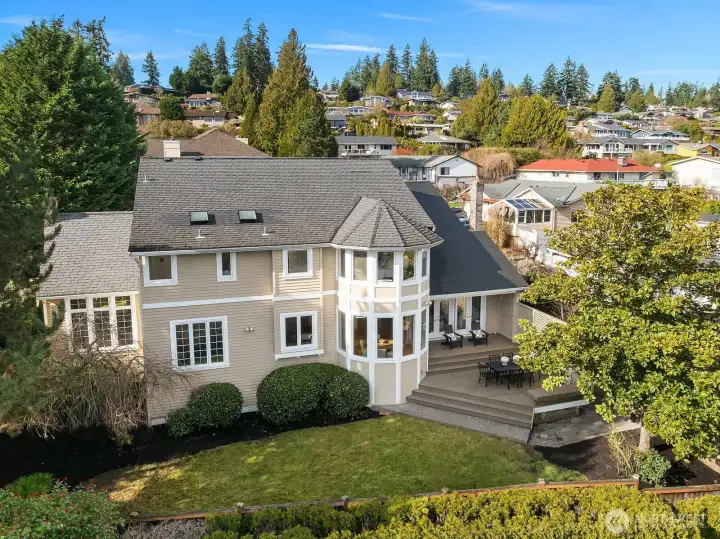 This impressive custom home commands attention with its stately craftsman-inspired architecture, elegant multi-pane windows, and beautifully manicured landscaping framed by mature trees dressed in autumn color. The grand circular driveway and refined exterior finishes set the tone for the exceptional quality and thoughtful design found throughout the interior. This impressive custom home commands attention with its stately craftsman-inspired architecture, elegant multi-pane windows, and beautifully manicured landscaping framed by mature trees dressed in autumn color. The grand circular driveway and refined exterior finishes set the tone for the exceptional quality and thoughtful design found throughout the interior.