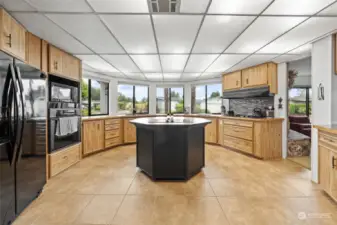 Unique circular kitchen has plenty of cabinets and counter space.