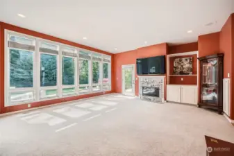 Marble surround fireplace with door leading to porch with hot tub