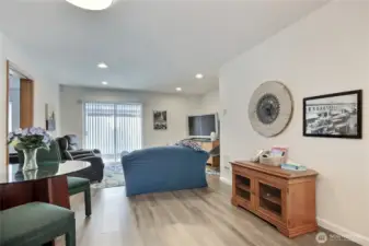 Actual photo. All furnishings (excluding the 2 recliners) and TV in this photo transfer with property.