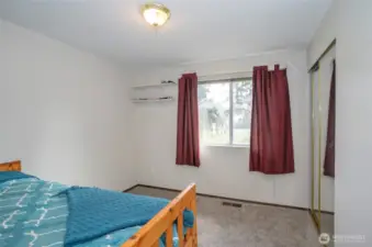 Guest suite offers plenty of natural light and new carpeting throughout.