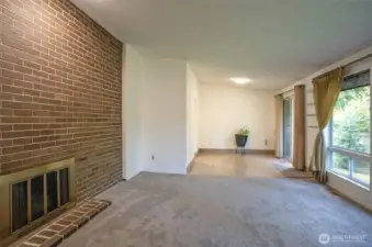 View from the living area into the dining area, featuring stylish tile flooring.