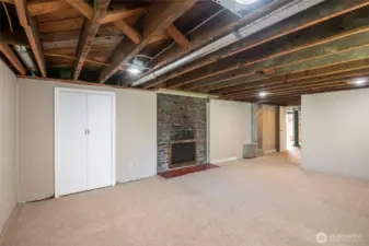 Lower level (accessed through atrium) with laundry, 3rd bath, rec room with fireplace and plenty of additional storage space + room for hobbies.
