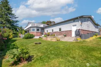 Fire pit, adirondack chairs, barbecue are included in the sale of this home