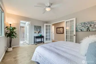 This spacious primary bedroom offers direct access to the ensuite bath and features oversized windows for abundant natural light.