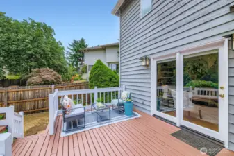 The Family Room opens to a sunny deck via glass sliders, extending your living space outdoors and offering room for alfresco dining.