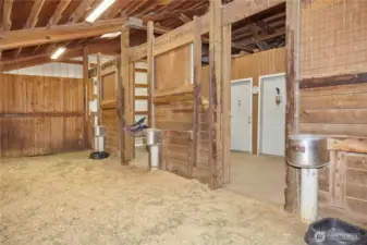 Stables are equipped with automatic horse waterers for added convenience and animal care. Owner has accessories to divide the stalls.