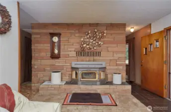 Charming wood-burning stove provides both ambiance and comfort throughout the colder months