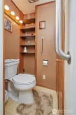 Access to water heater through guest bathroom.