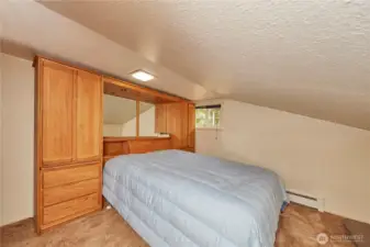 An inviting bonus room awaits upstairs, just steps from the dining space, offering flexibility and comfort.