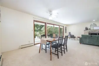 A large dining area is adjacent to the living room.