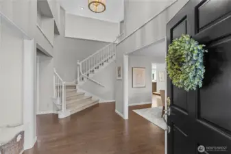 Grand two story entrance with beautifully redone hardwoods