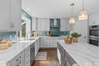 Look at all the counter space and a corner walk in pantry