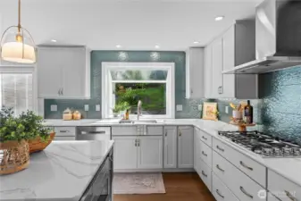 Gorgeous artistic back splash adds a touch of whimsy