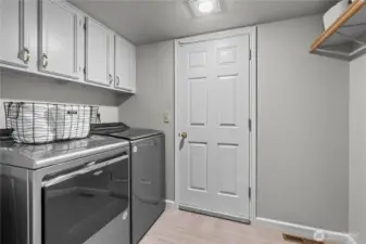 Laundry off of the kitchen leads to the large 3 car garage
