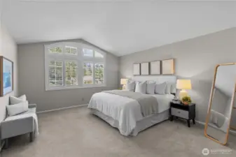 Enormous primary suite with custom shutters and architectural windows