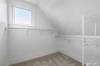 The walk-in closet has a view of the water.