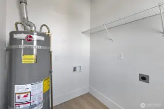 The utility room offers good storage and natural light.