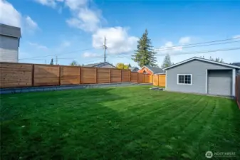 The fully fenced backyard features a detached garage that you can keep for parking OR convert to a future DADU since you have driveway parking.