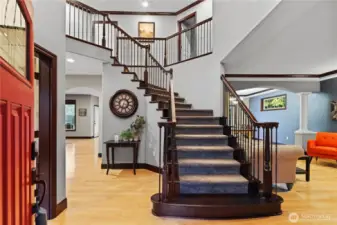 A grand staircase welcomes you into this lovely home