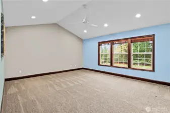 GENEROUSLY-sized primary bedroom overlooks the backyard